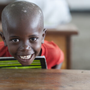 Kid at school table