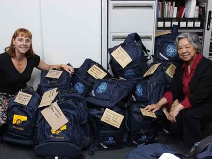 Jodie and Sarah packing bags of donations for Ephphatha School for the Deaf in the Democratic Republic of Congo