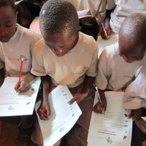 children writing letters to sponsors